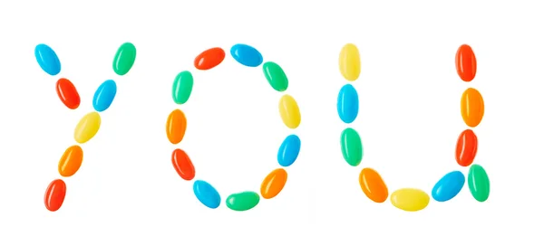 "usted "letras hechas de caramelos multicolores aislados en blanco — Foto de Stock