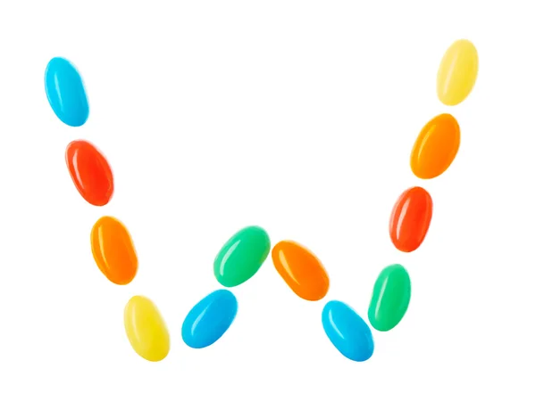 W lettera fatta di caramelle multicolore isolato su bianco — Foto Stock