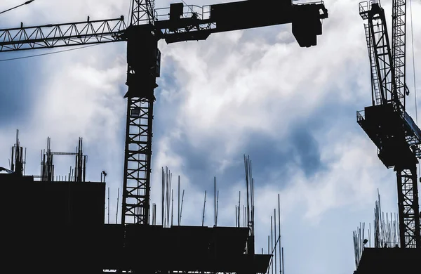 Silhouette City worker, construction crews to work on high ground heavy industry