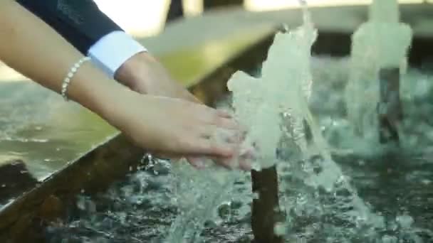 Brides hands in the fountain — Stock Video