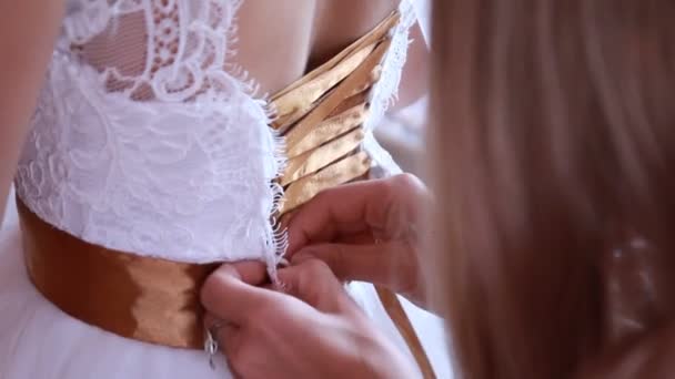 Bride getting ready. beautiful bride in white wedding dress with hairstyle and bright makeup. Happy sexy girl waiting for groom. Romantic lady in bridal dress have final preparation for wedding — Stock Video