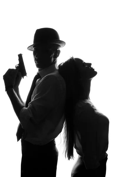 Silhouette of detective with beautiful woman isolated on white background — Stock Photo, Image