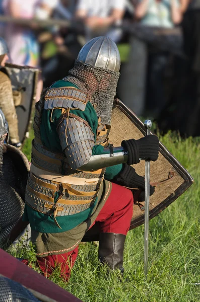 Russian warrior in iron helmet prepares to fight — Stock fotografie