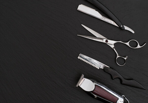Barber shop tools on Black with place for text.