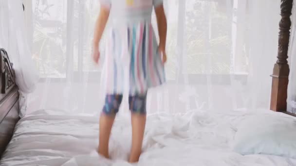 Happy Family Idyll Little Child Daughter Jump On Father Arms And They Fall On A Bed — Stock Video