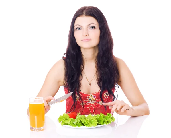 Happy young lady eating salad. — Stock Photo, Image