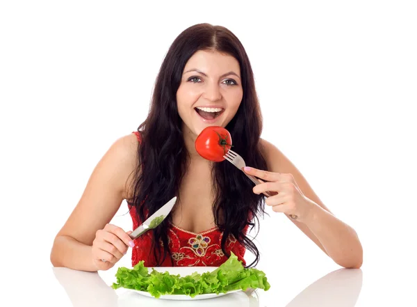 Happy young woman eating salad. — Stock Photo, Image