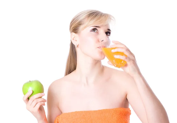 Beautiful girl with orange juice and apple — Stock Photo, Image