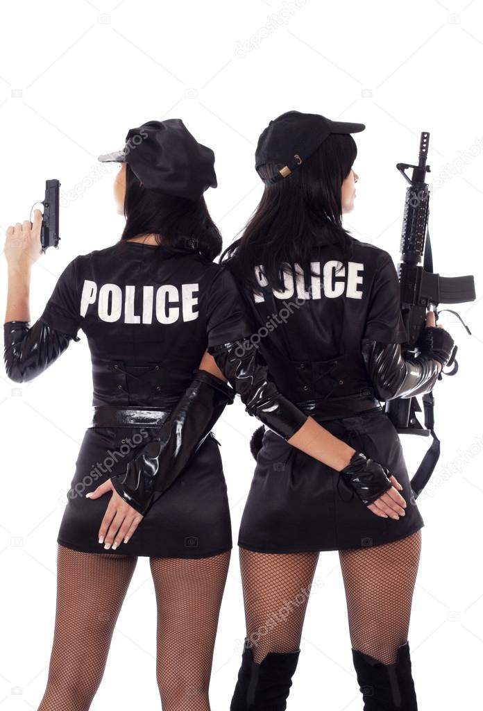 Two sexy women in police uniform. Halloween