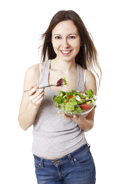 Felice giovane donna mangiare insalata. — Foto Stock