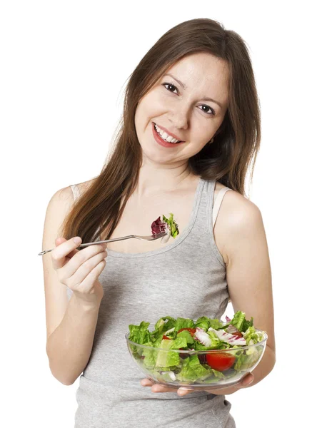 Happy young woman eating salad. — Stock Photo, Image