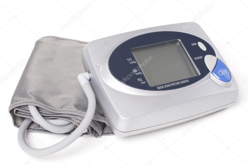 Digital blood pressure monitor on white background