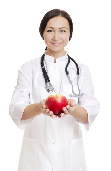 Γιατρός κρατώντας μήλο - εικόνα αποθεμάτων — Φωτογραφία Αρχείου