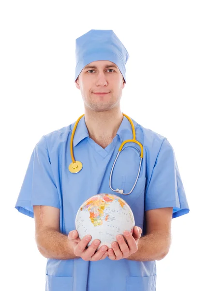 Male doctor holds world globe in his hands. — Stock Photo, Image