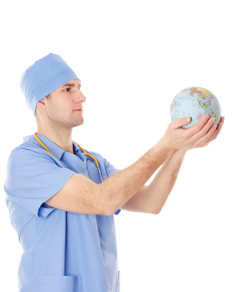 Male doctor holds world globe in his hands. — Stock Photo, Image