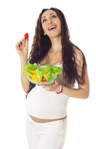 Schwangere isst Salat. — Stockfoto
