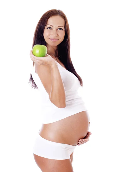 Femme enceinte avec pomme. — Photo