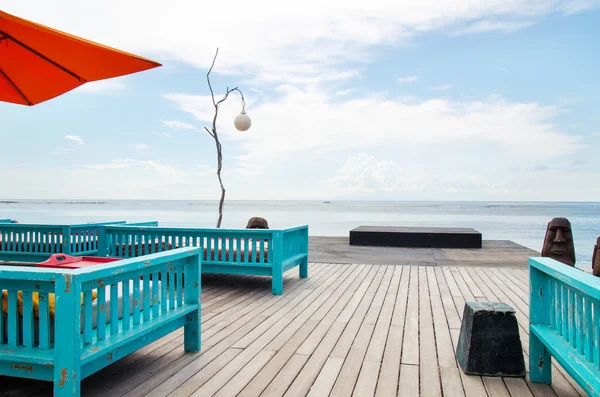 Deck chair and patio at ocean — Stock Photo, Image