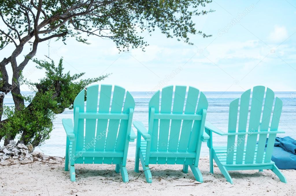 Turquoise beach chairs - Stock image.