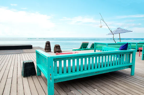 Deck chair and patio at ocean - Stock image — Stock Photo, Image