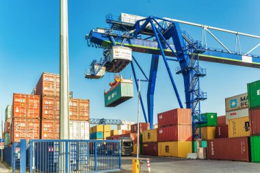 Frankfurt, Germany - 23.02.2021 - Crane loads containers for international export to other cities and countries