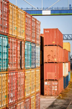 Frankfurt, Germany - 23.02.2021 - Many stacked containers for worldwide export in different colors in harbour area