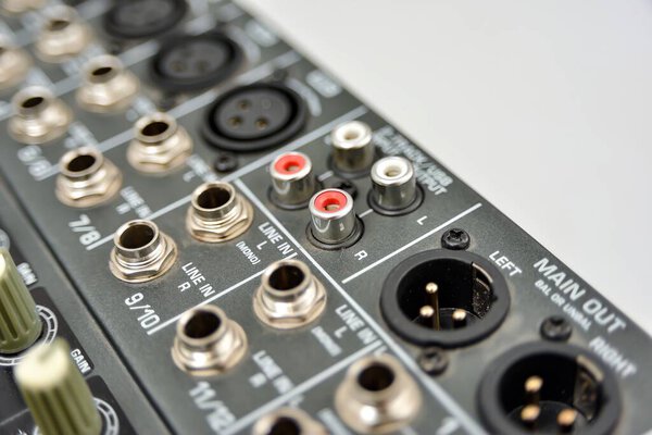 Audio line-in on a mixing console, close-up.