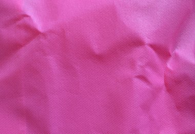 Tangle pink polypropylene fabric fiber.Non-woven fabric or crinkled light purple polypropylene background texture clipart