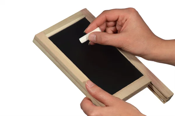 Hands with blackboard and chalk — Stock Photo, Image