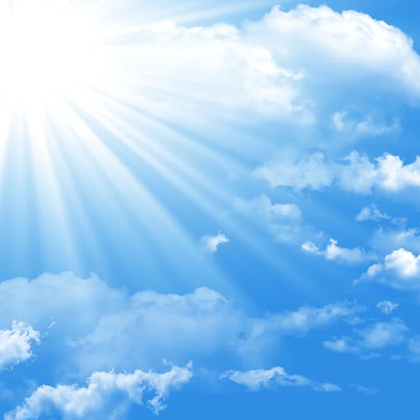 Blue sky with clouds and sun — Stock Photo, Image