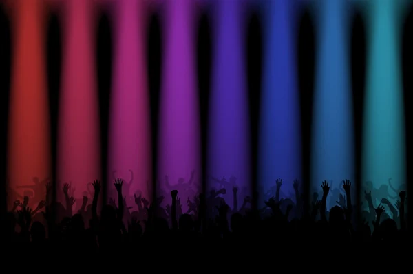Silhouettes of people at a concert with colored lights — Stock Photo, Image