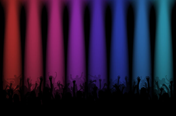 silhouettes of people at a concert with colored lights