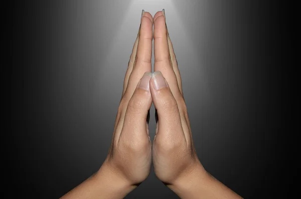 Mãos fechadas na oração — Fotografia de Stock