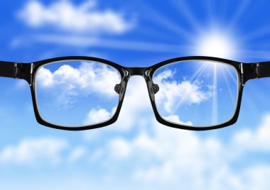 very blurry sky and glasses with blue sky clipart