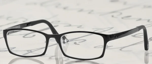 Óculos com molduras pretas — Fotografia de Stock