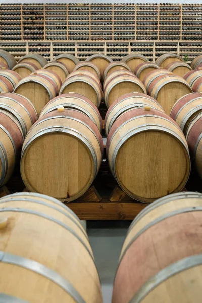 Wooden wine barrels for storage in wine cellar