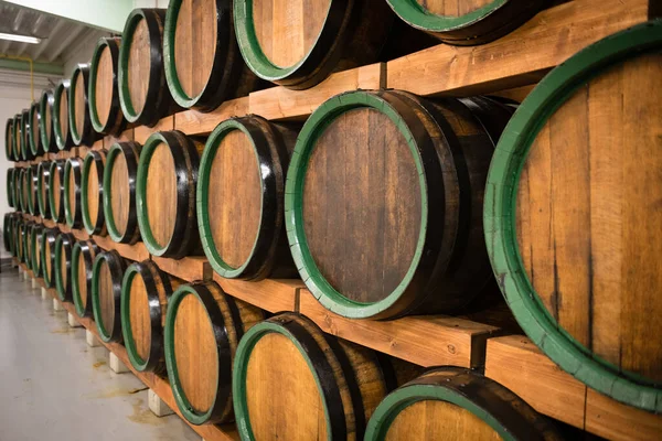 Wooden wine barrels for storage in wine cellar