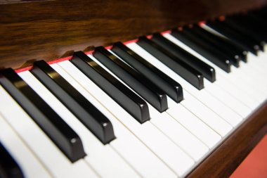 Keyboard of classic piano, close up with blurry background