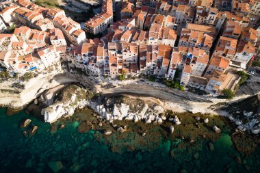Houses on top of a limestone cliff high above the Mediterranean Sea. Bonifacio, Corsica island, France