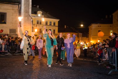 BANSKA STIAVNICA, SLOVAKIA - SEP 8, 2017: Salamander days parade is mining tradition with masked  figures, miners in historic clothing from different regions walk through the city. It is part of Slovak Cultural Heritage since 2013.