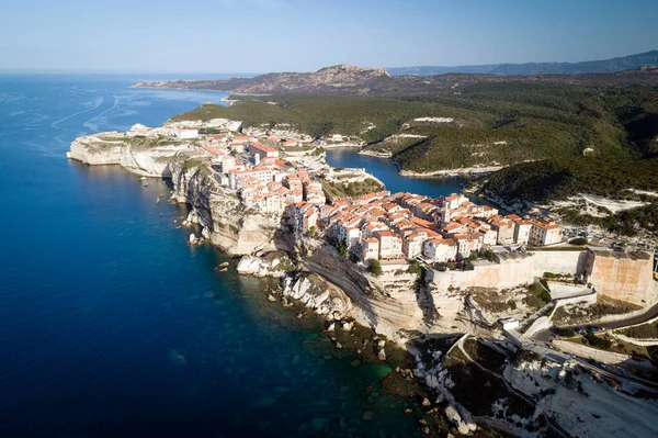 Aerial view of limestone cliffs, and the old town of Bonifacio, Corsica island, France
