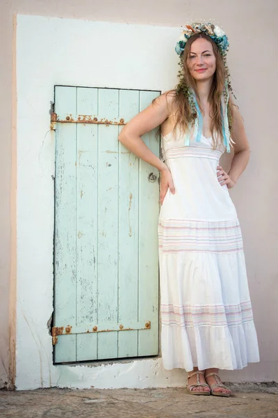 Young Woman White Dress Flower Head Band Standing Door — Fotografia de Stock