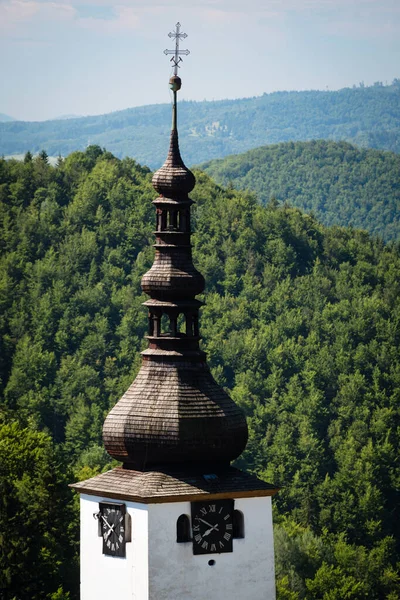 Church tower in old mining village Spania Dolina, Slovakia