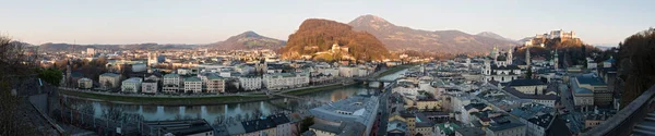 Panoramic view of historic city of Salzburg with river Salzach at dusk Austria