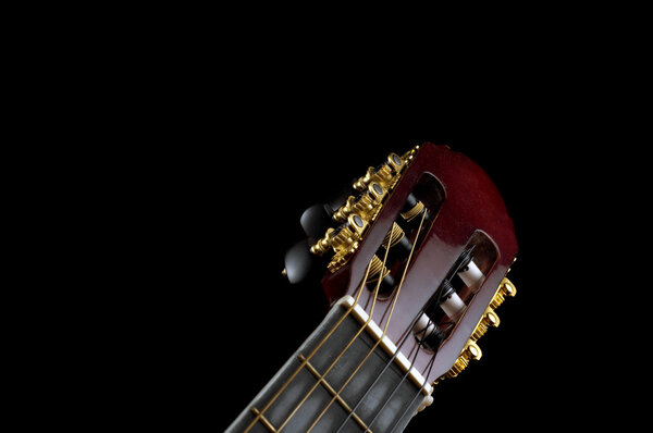 Classic guitar headstock on black background