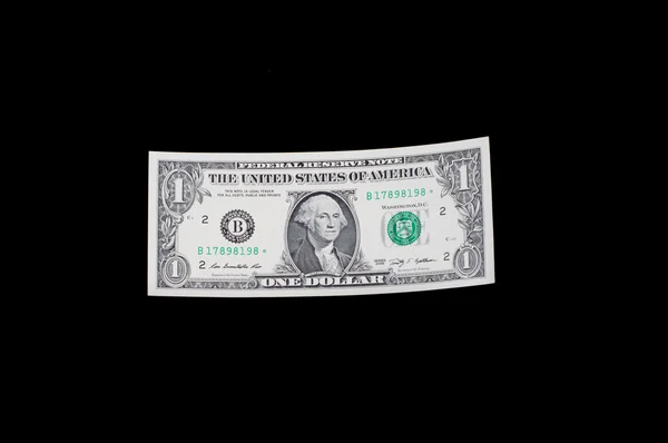 Dollar bill on black — Stock Photo, Image