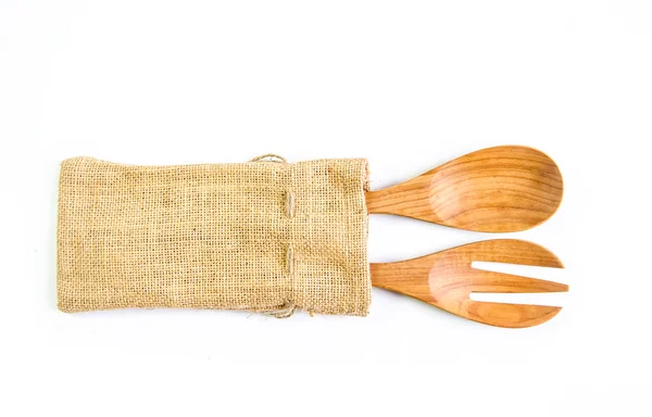 Colher de madeira e garfo na superfície do saco. Isolado no backgrou branco — Fotografia de Stock