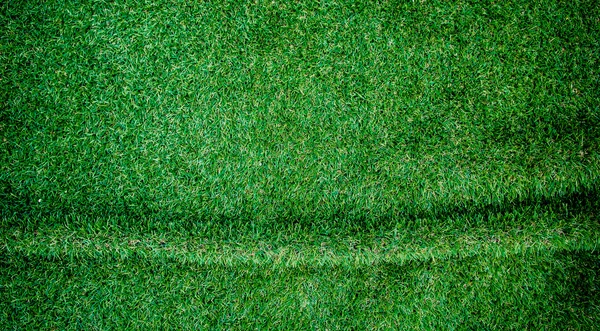Umělá tráva vrásčitá pozadí. — Stock fotografie