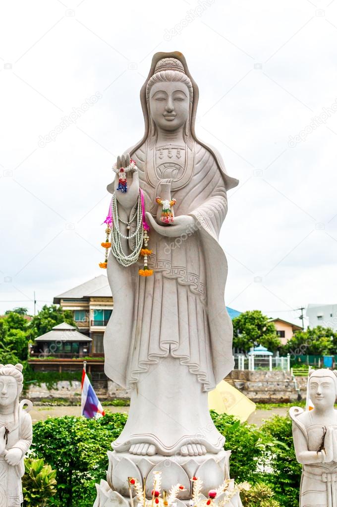 Statue of Guanyin goddess of Mercy. Buddha Chinese art.