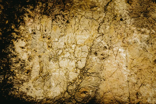 Gros plan texture de grunge fissuré vieux mur de pierre. — Photo